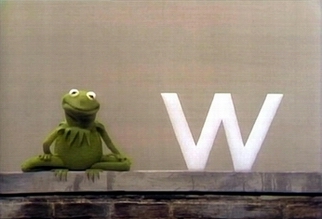 Kermit the Frog giving a lecture on the letter "W."