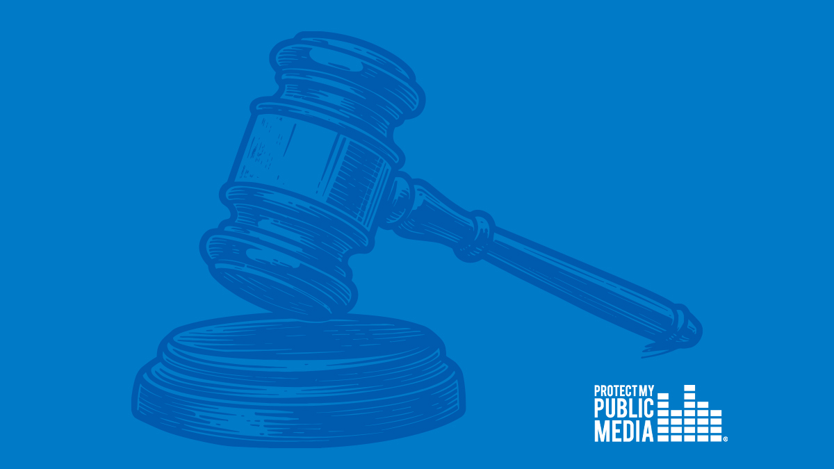 A bold, monochromatic blue graphic featuring a large judge’s gavel angled downward as if striking a sound block, symbolizing a legal ruling or court decision. In the lower right corner, the Protect My Public Media logo appears in white, reinforcing the connection to public media advocacy.